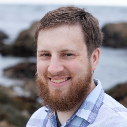 Brendan Andrade, a white man with a beard smiling